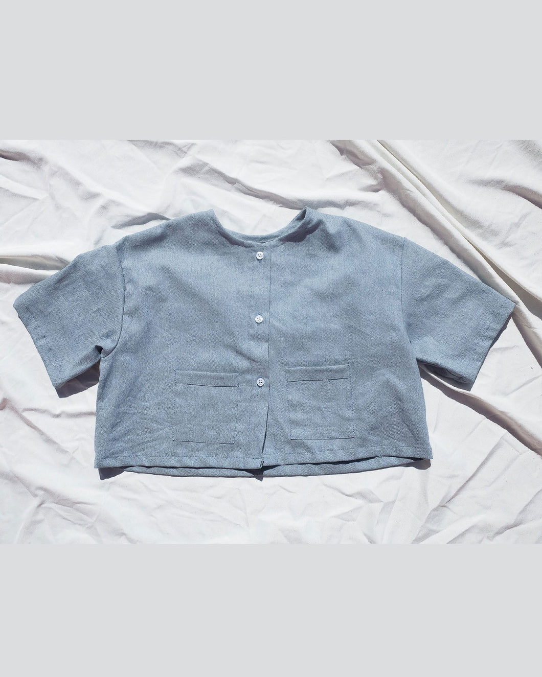 Gender neutral shirt for toddlers and kids. Premium Upcycled Denim Button Up Top with Denim Pockets